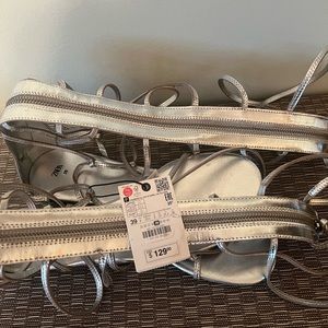 NWT. Zara Silver Strappy Flat Sandals with Buckle Details. Size 8